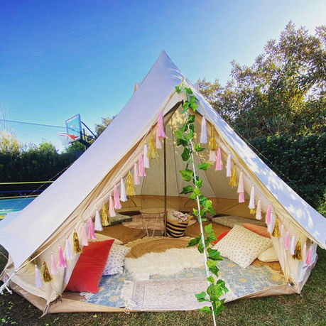 Bell tent glamping day party setup. Camping tent.