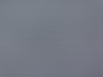 Roofer installing Class 4 impact-resistant asphalt shingles on a Texas home in a hail-prone area