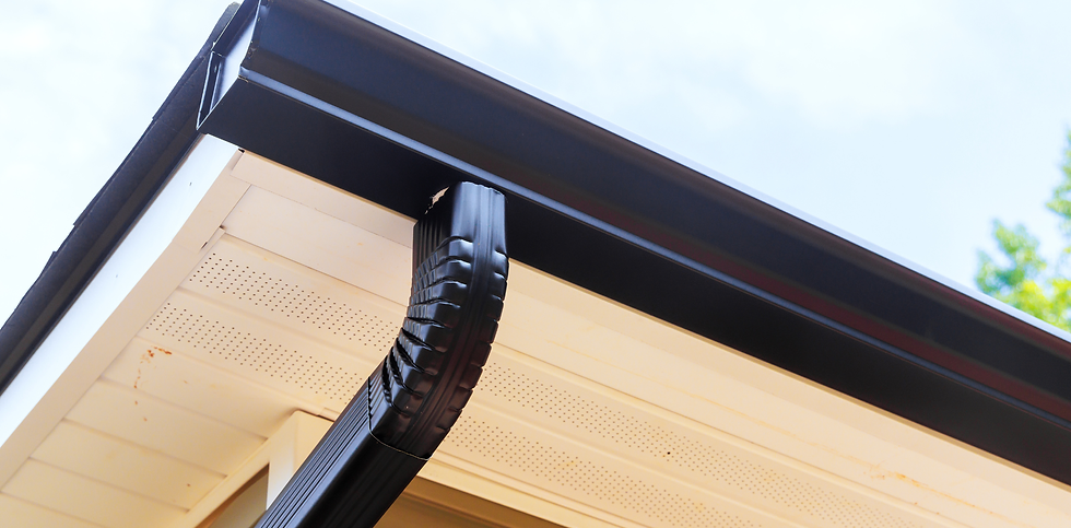 Seamless gutters installed along the roofline of a Central Texas home by Shield & Shelter Roofing.
