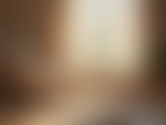 Eye-level view of a cozy room with a comfortable chair and soft lighting