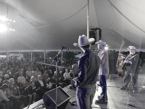 A side stage view of The Western Flyers with Redd Volkaert and the crowd