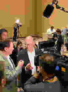 Tom Perez talks to media at the strip caucus at the Bellagio casino in Las Vegas.