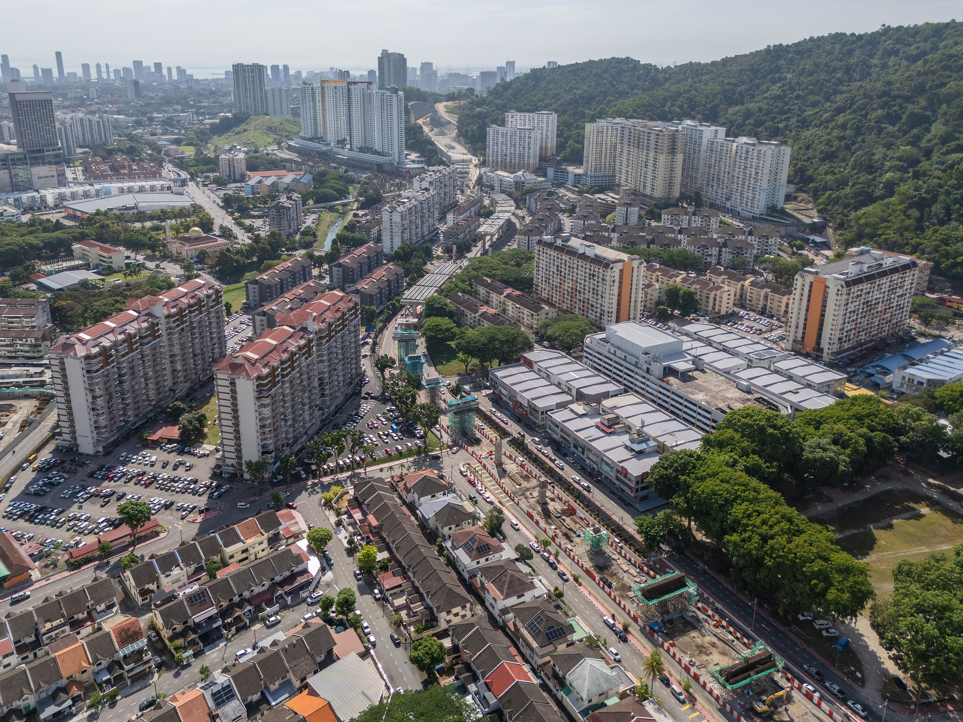 Highway construction bypassing forest into residentials