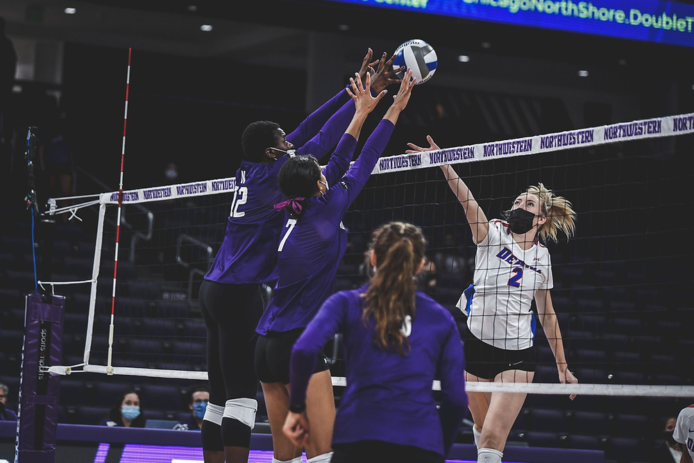Thomas-Ailara blocks an attack from a DePaul player.