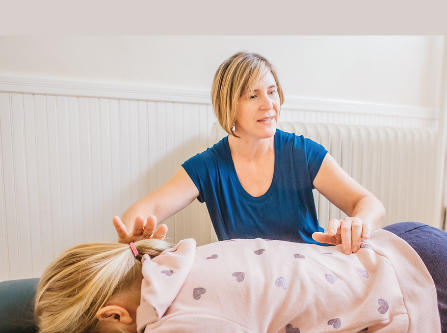 Dr. Julia Wilson adjusts a patient 