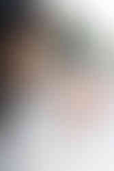 ベビードレスを纏った赤ちゃん