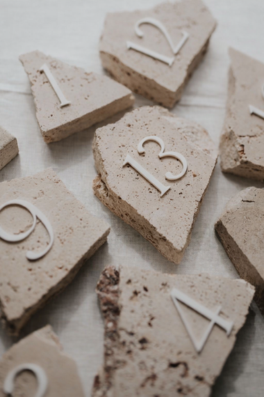 Stone table numbers for a luxury Ibiza wedding