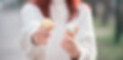 Girl in a white sweater holds out two ice cream cones._edited.jpg