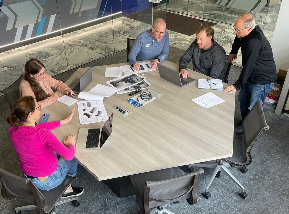 Staff evaluating exhibit performance and long-term strategy planning
