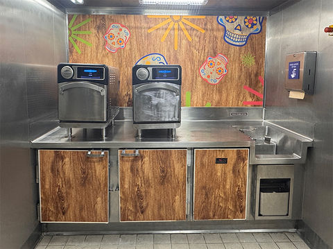 Commercial kitchen with colorful vinyl installed over cabinets