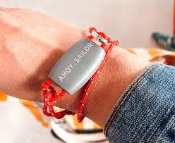 A custom made paracord bracelet with an "ahoy, sailor" charm.