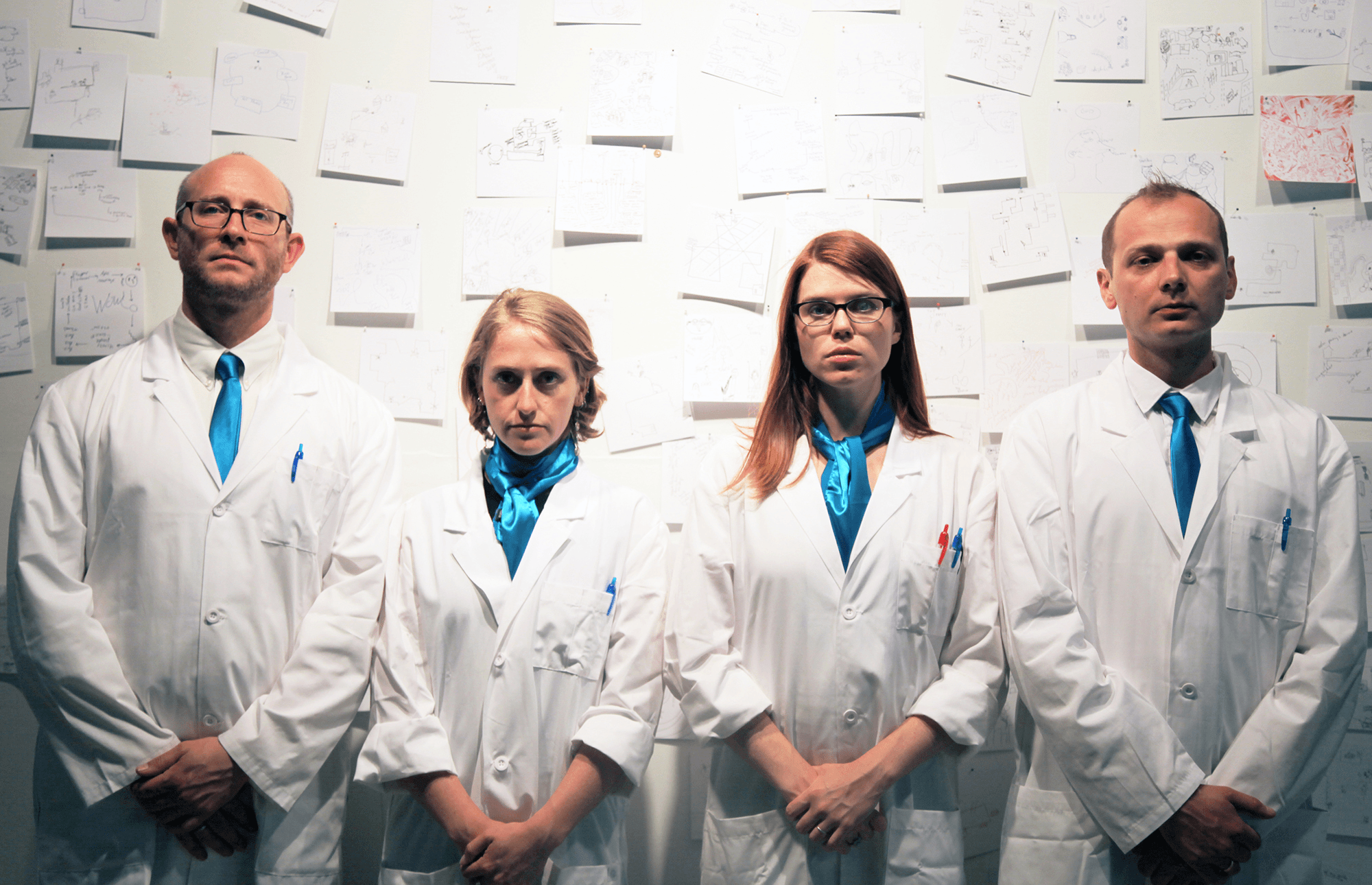 humorous gif showing Institute for Psychogeographic Adventure co-founders in lab coats looking serious, and then making funny poses, as a conclusion to the contact page.