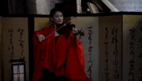 repeating video gif montage of a woman in a red kimono playing a violin and a dancer in Brooklyn NY that was part of an interactive theater performance performance by the Institute for Psychogeographic Adventure.
