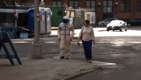 repeating video gif montage of a man and woman dancing down an alleyway and an astronaut in Brooklyn NY that was part of an interactive theater performance performance by the Institute for Psychogeographic Adventure.