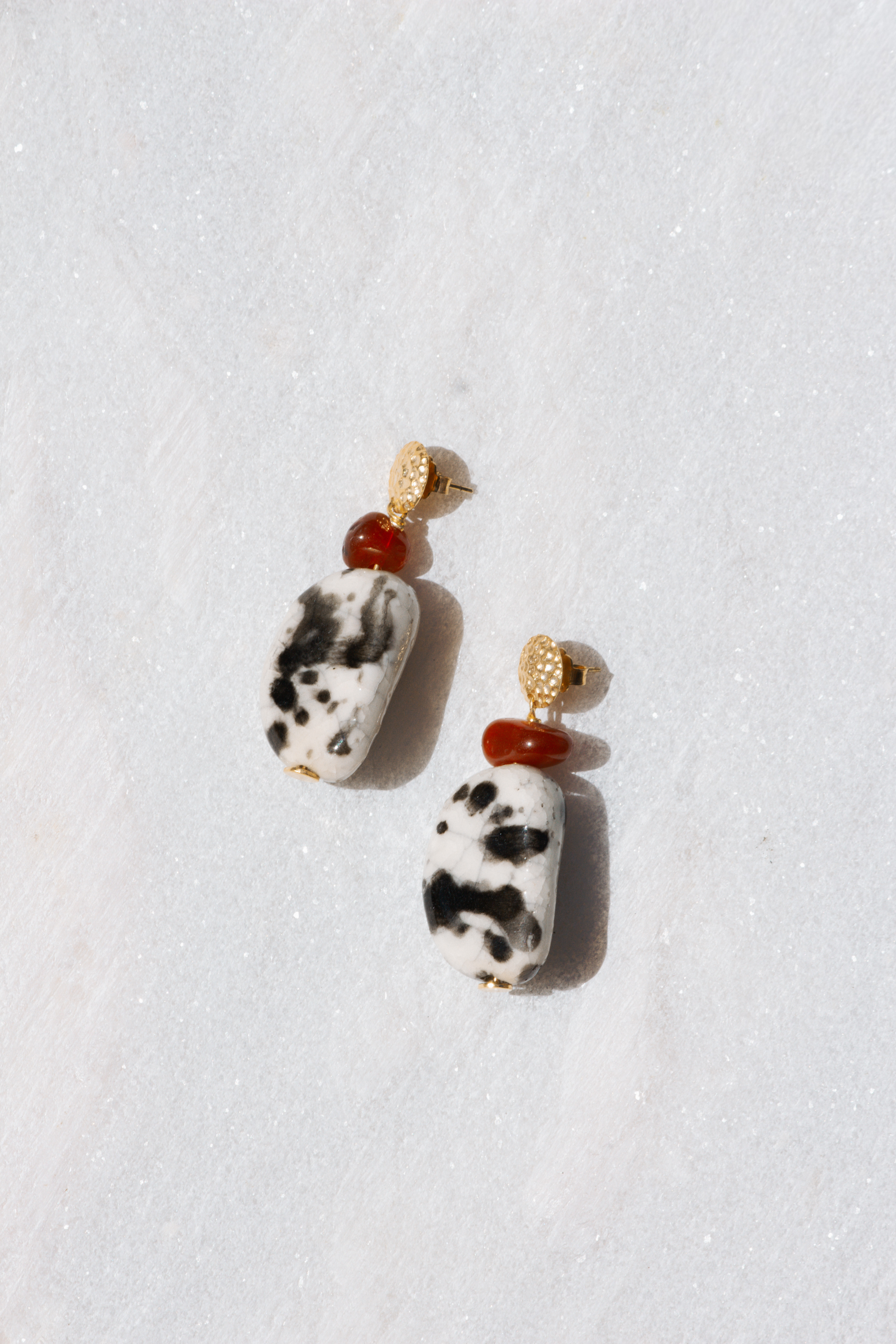 Ceramic drop earrings with textured gold stud and patterned bead