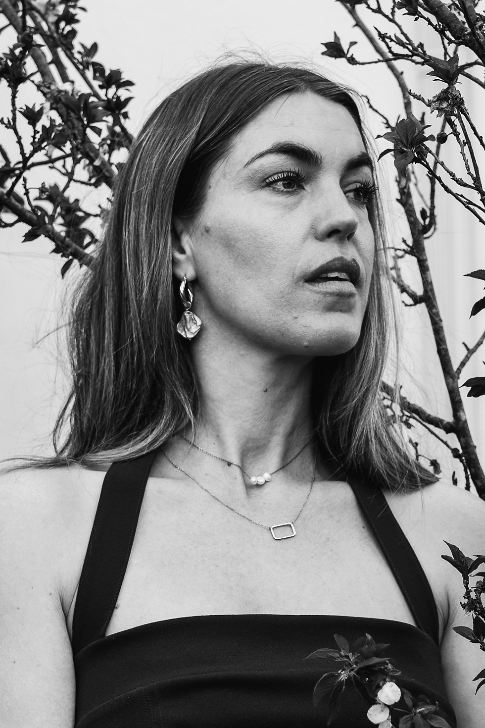 Model wearing sterling silver rectangle pendant necklace
