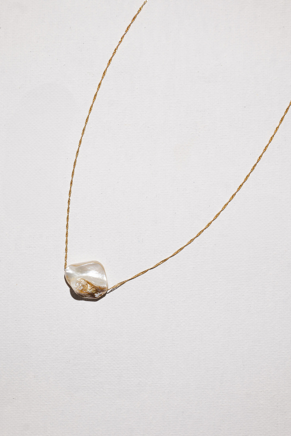 Organic shell pendant necklace on twisted sterling silver chain