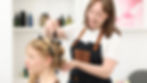 Hairdresser styling client in salon - owner-operator SME