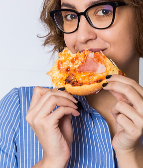young-woman-eating-pizza-isolated-white-