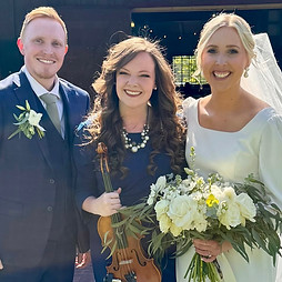 Lindsey with a Couple at a Wedding