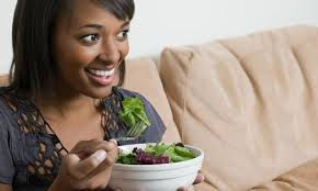 woman eating salad