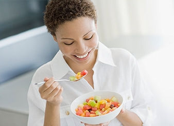 woman eating fruit pic