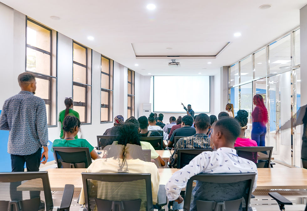 Students engaged in an interactive lecture session inside a glass-walled seminar room at the LASU Innovation Hub, designed for collaborative learning and skill development.