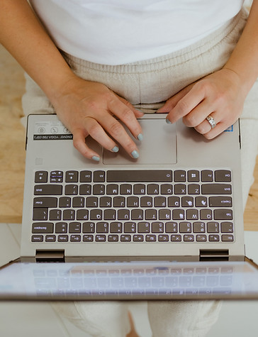 A generic photo of hands typing on a laptop