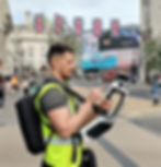 TopoCrew surveyor using NavVis VLX laser scanner in Central London street