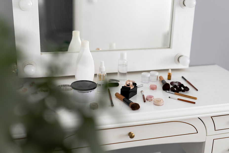 high-angle-messy-makeup-products-table.jpg