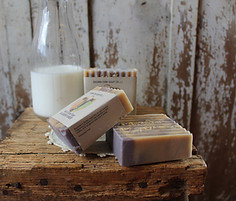 natural handmade soap bars displayed on a stool
