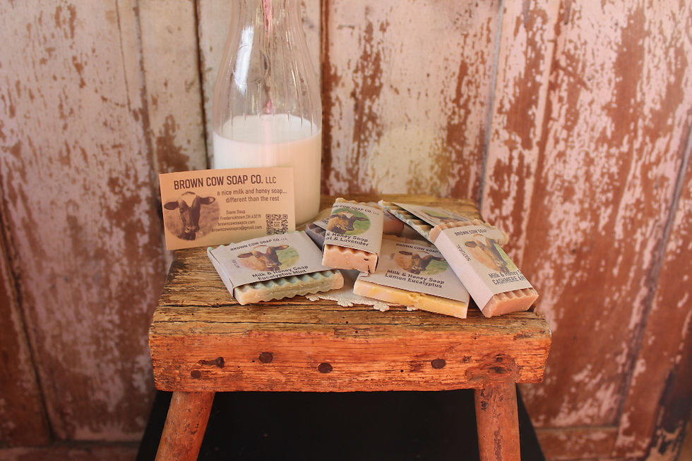 courtesy bars of soap samples on stool with milk bottle