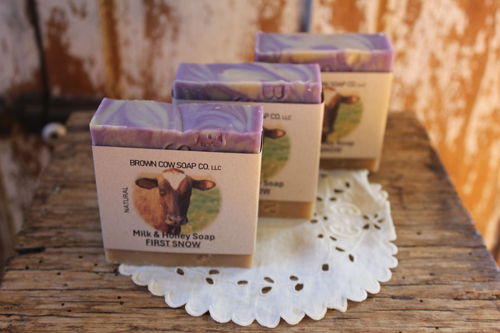 three bars of lavender colored soap in a row