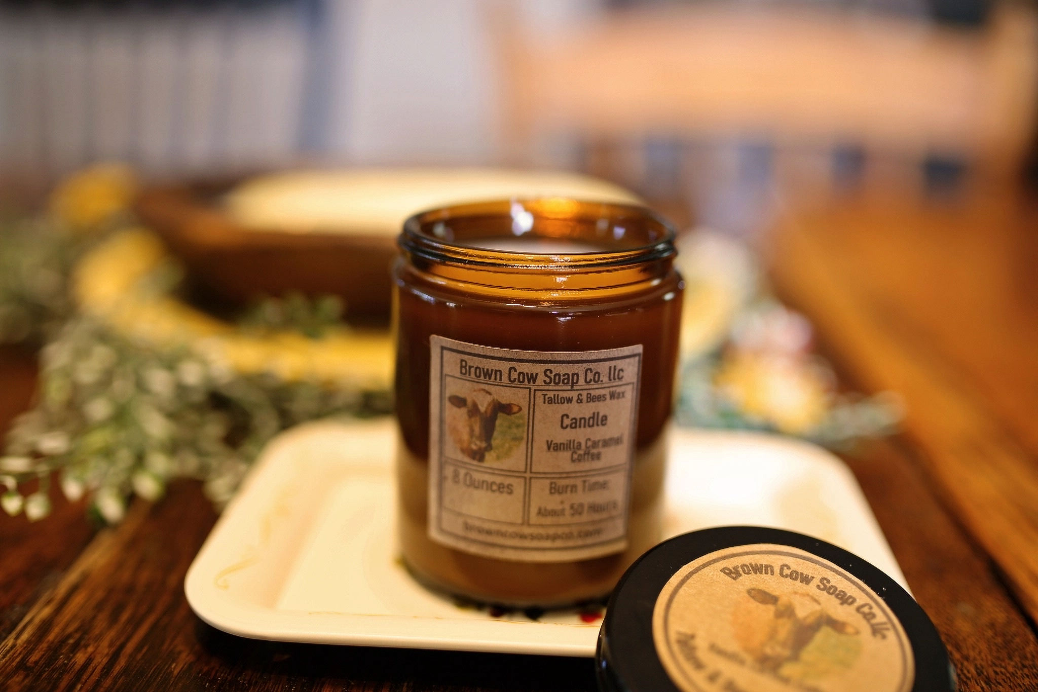 natural tallow and beeswax candle in amber glass jar