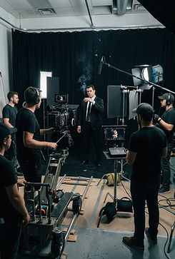 Christtian Wodson on a film set with a camera crew