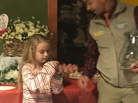 Mebane Business Association Valentines Social my sweet daughter helps Mo Bass draw the winners!