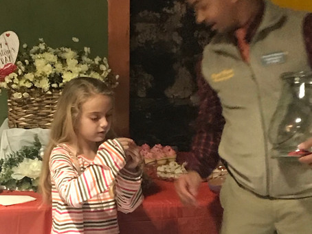 Mebane Business Association Valentines Social my sweet daughter helps Mo Bass draw the winners!