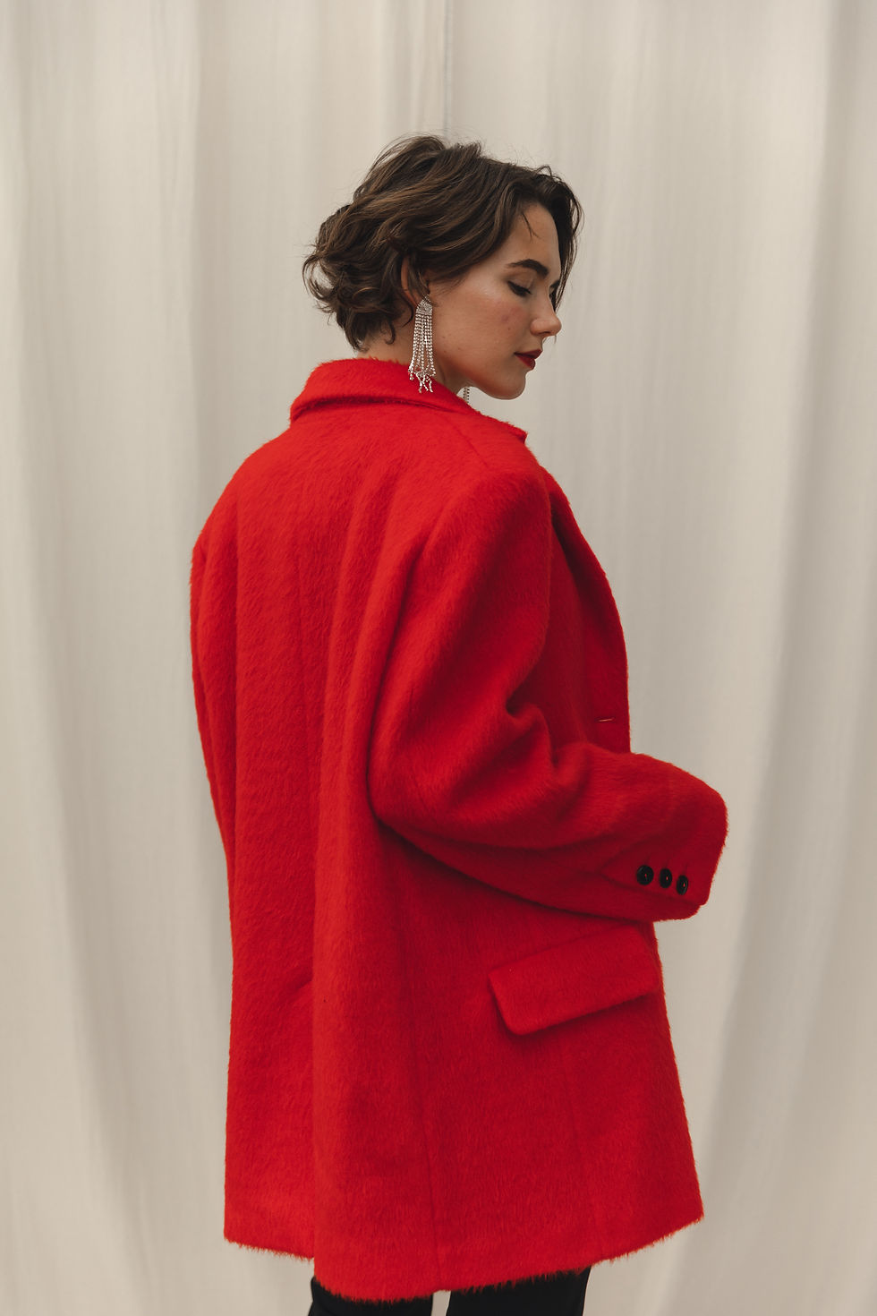 Thumbnail: Side view of Kaniv Red Jacket by WeHeat - showcasing the straight silhouette and slash pockets