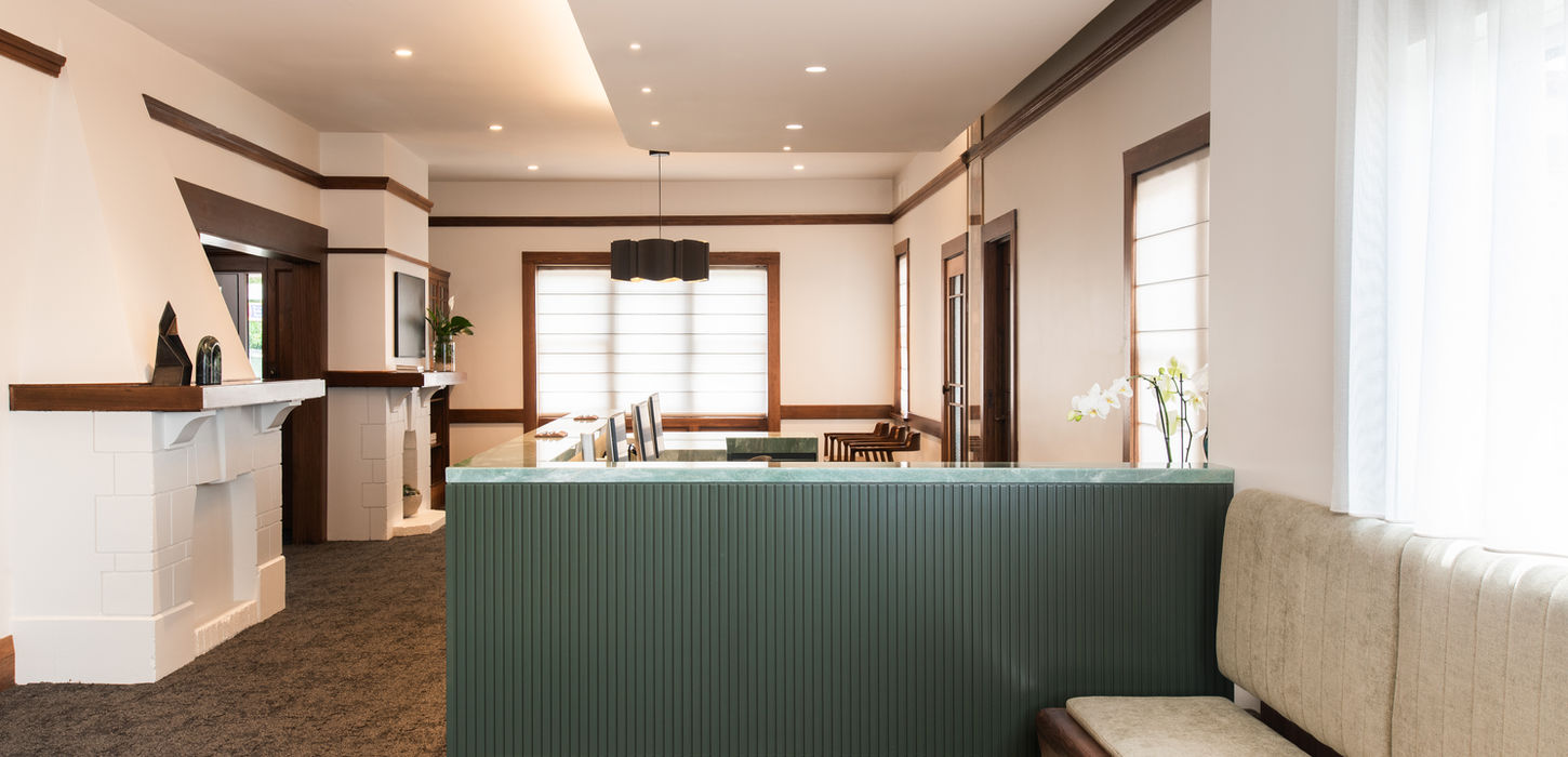 Spacious patient waiting room with comfortable seating and natural light at Dr Daniel Tan & Associates dental practice