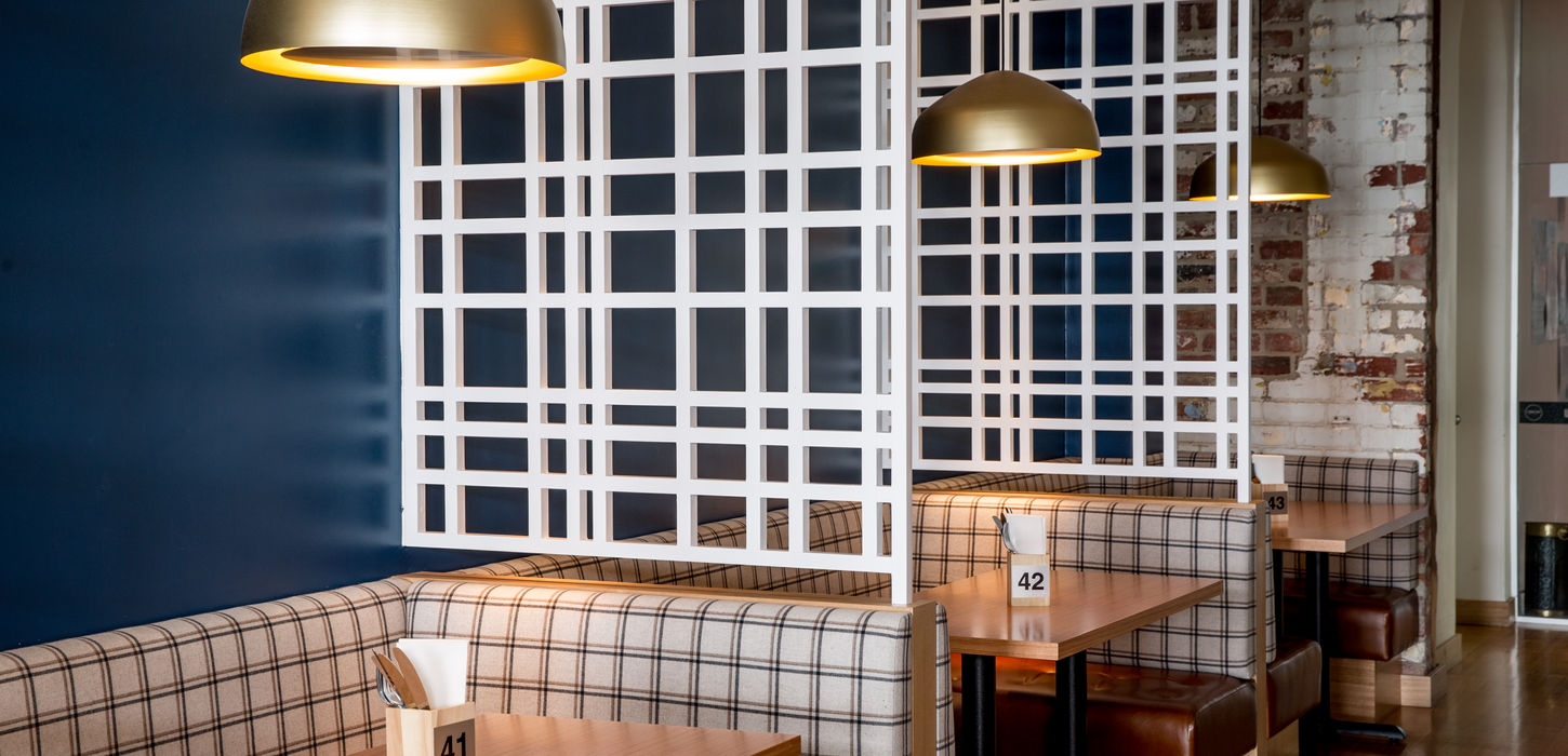 Indoor dining at Post Street social, featuring a booth set up