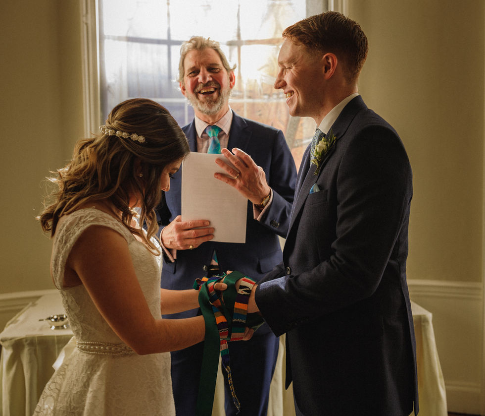 Happy couple exchanging vows during wedding ceremony