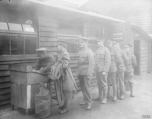 Ministry of Information First World War Miscellaneous Collection Army Service Corps. Mechanical Transport Section. Recruits (transfers from other Regiments) giving the clerk particulars for their Record sheets.