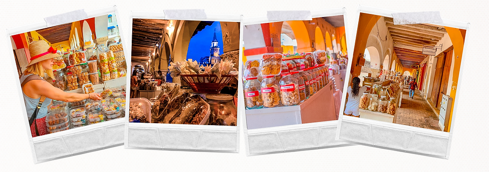 Puesto típico del Portal de los Dulces en Cartagena con cocadas, muñecas de leche y tamarindos artesanales frente a la Torre del Reloj.