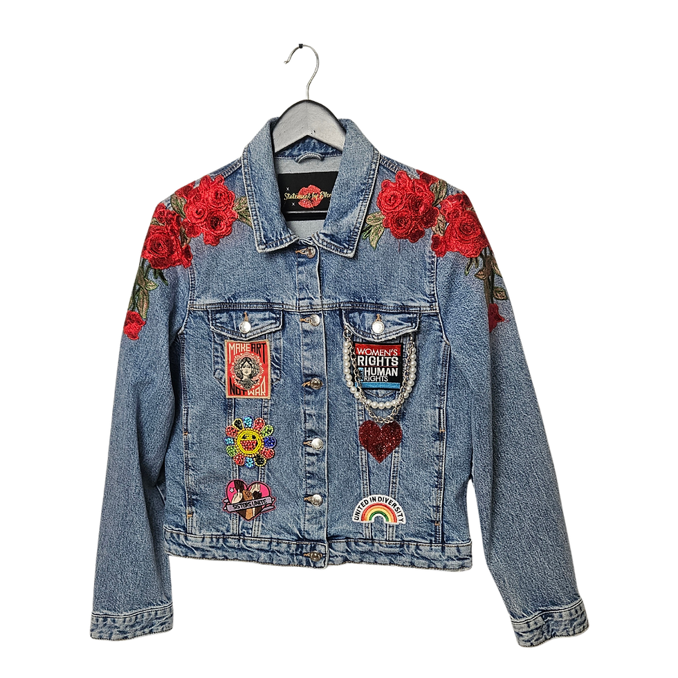 Front of Persist Series Sisters Unite upcycled denim jacket in LA features red rose embroidery, Make Art Not War, diversity