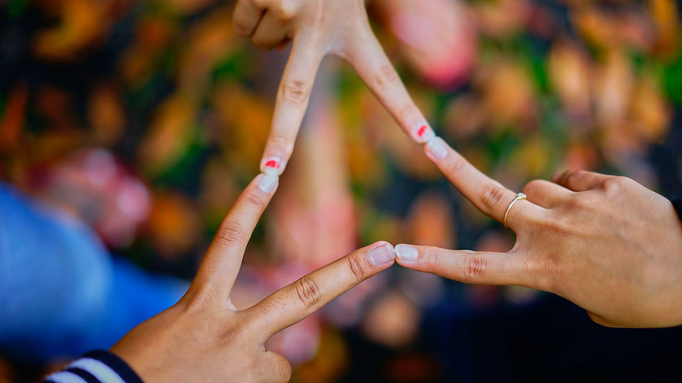 three hands and finger connecting to show inclusivity