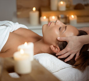 young-woman-having-face-massage-relaxing-spa-salon.jpg