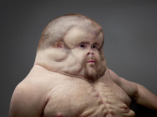 a car crashed into a tree with a person injured in the driver's seat and another person trying to help him