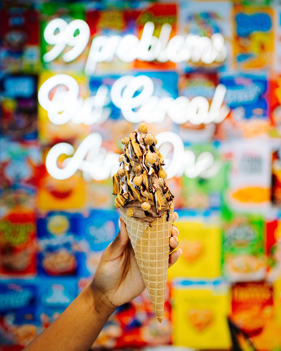 Close up of one of our ice cream soft serve swirls with cereal puffs, marshmallow, chocolate and caramel drizzle