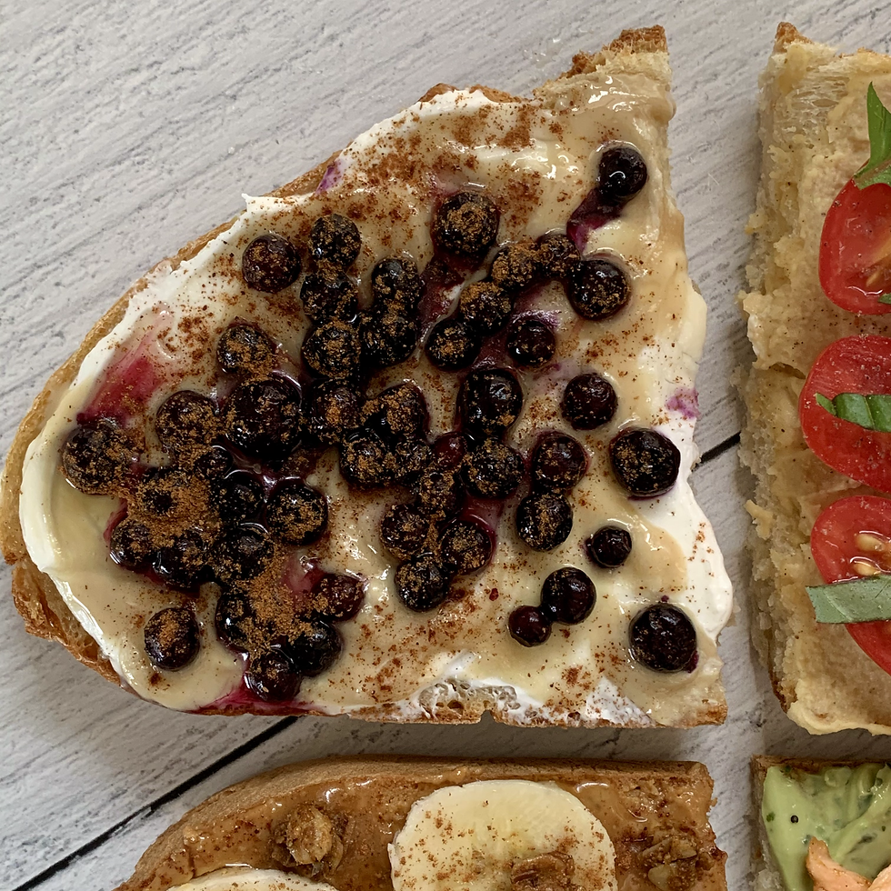 Sourdough toast with protein rich Greek yogurt, tahini, antioxidant rich wild blueberries, honey, and cinnamon make a great balanced breakfast
