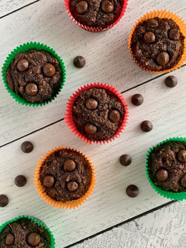 Gluten free zucchini muffins that taste like moist and fudgey brownies with shredded coconut mixed in